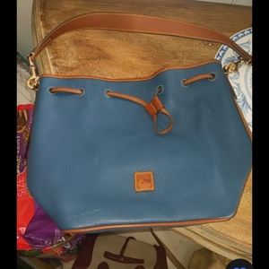 Authentic Dooney Bourke Hobo with papers and sleeper bag. New med size
